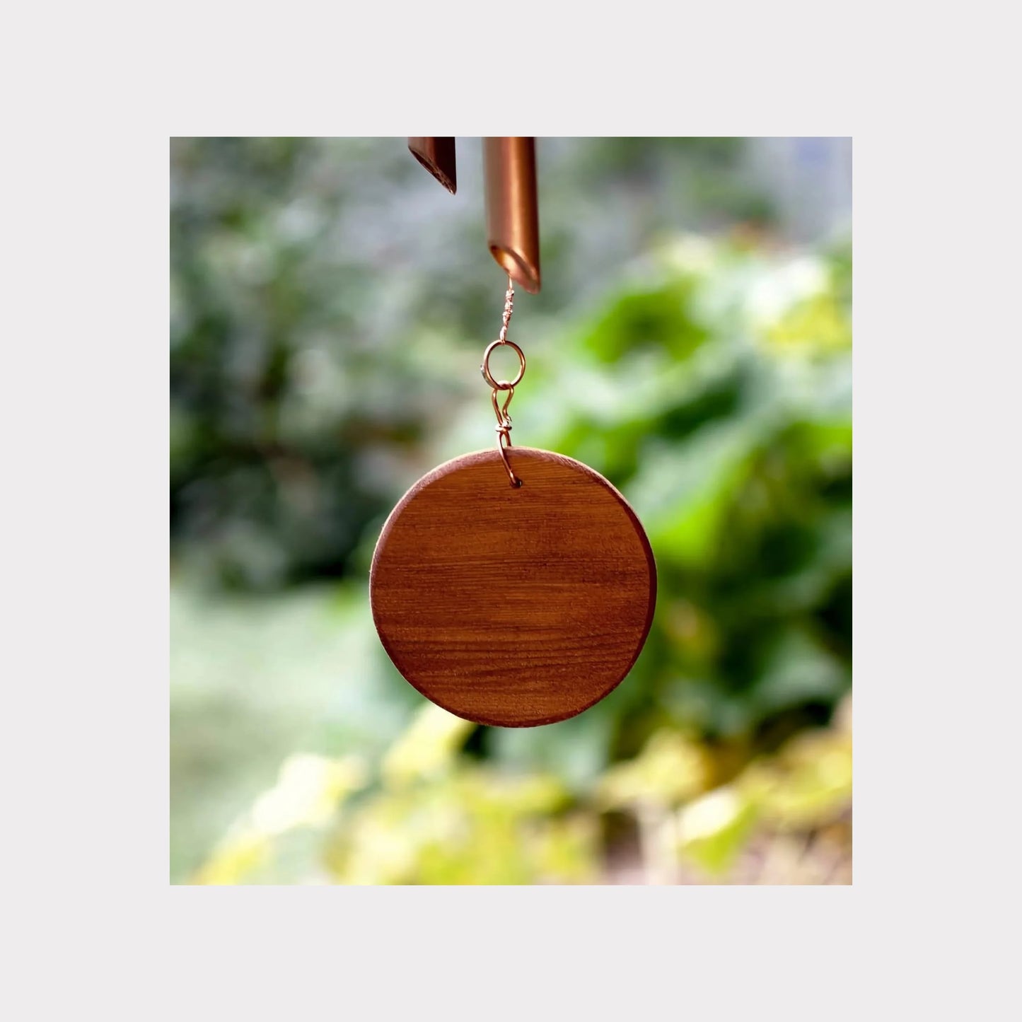 handcrafted round cedar windsail for handmade copper wind chimes.