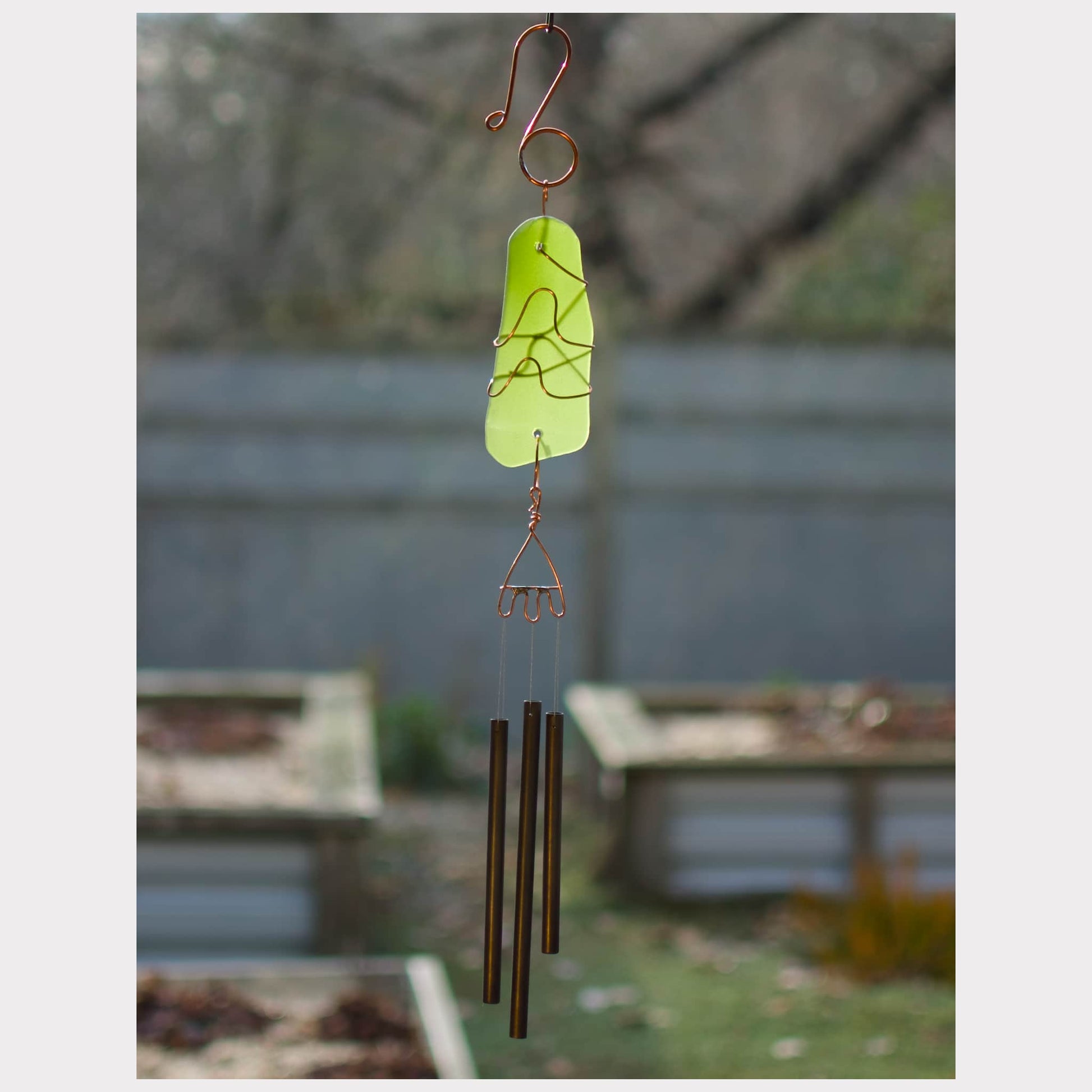 Sea glass handcrafted wind chime with three brass chimes.